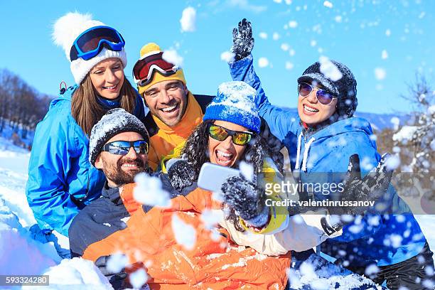 group of young skiers making selfie on snow mountain - friends skiing stock pictures, royalty-free photos & images