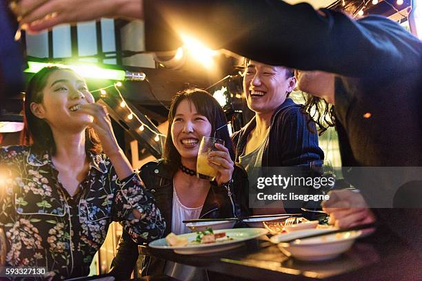 friends in a pub in japan - nightlife bar stock pictures, royalty-free photos & images