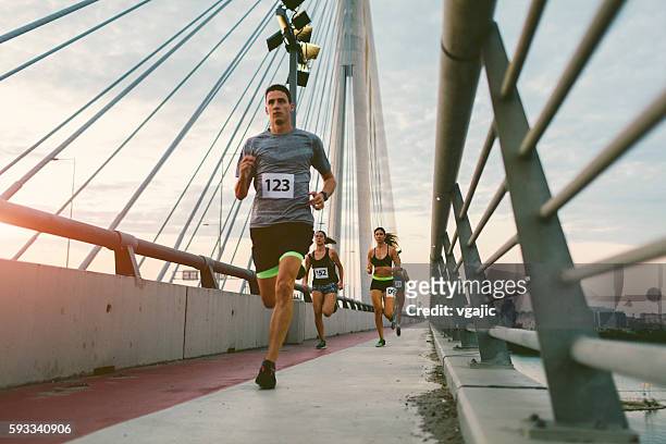 marathon runners. - man running city stock pictures, royalty-free photos & images