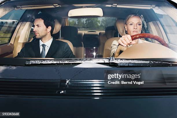 executives in car - windshield stock pictures, royalty-free photos & images
