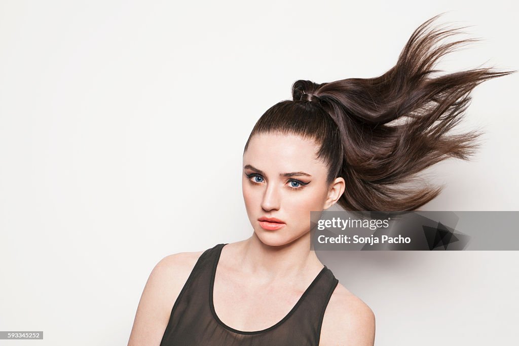 Portrait of woman with ponytail