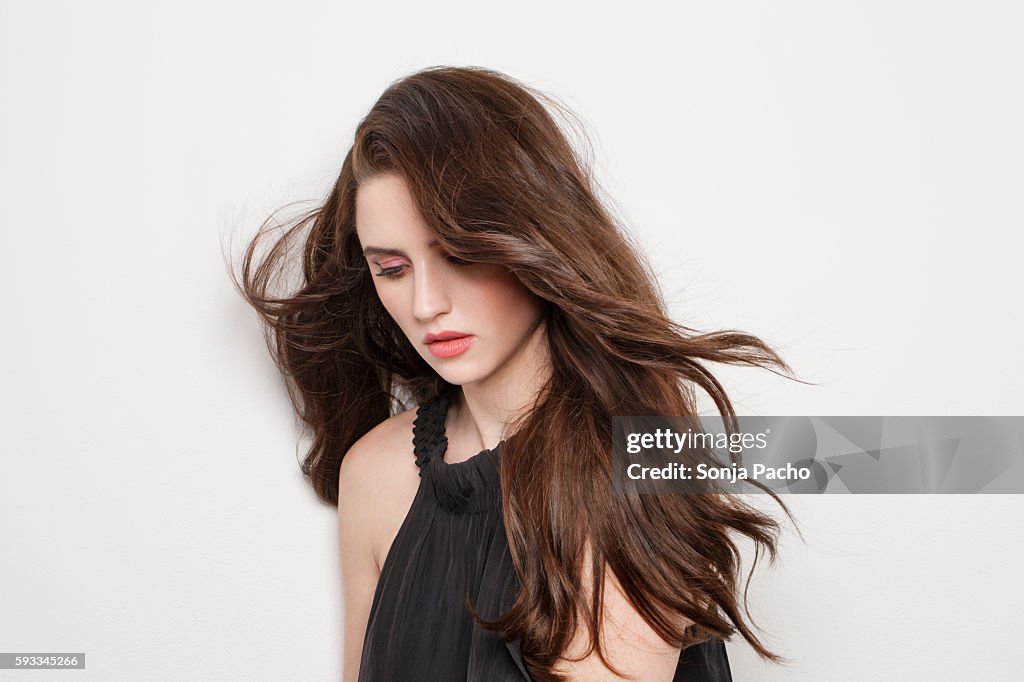 Studio portrait of young brunette woman