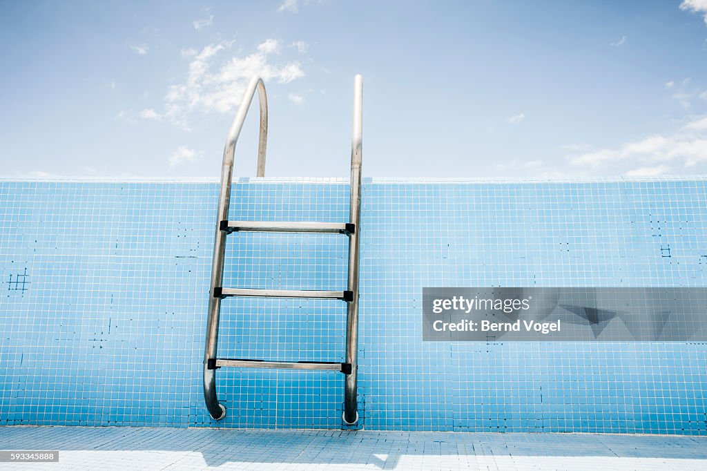 Pool ladder in empty pool