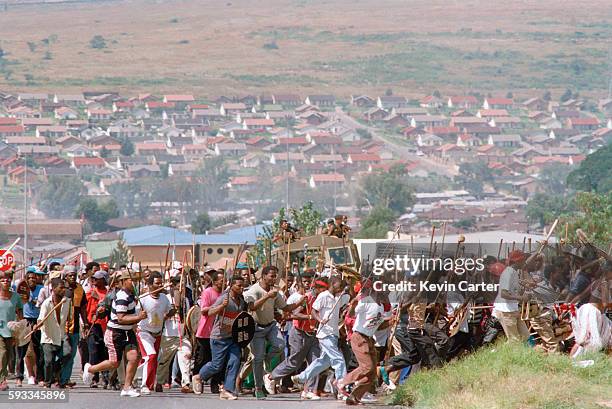 Zulu Impi toyi-toying in Alexandra township. They are heading to Orlando Stadium to hear Buthelezi speak at an Inkatha Freedom Party rally.