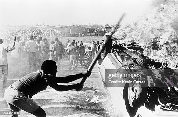 Riot in Duduza township during the funeral of four blacks killed during an attack on government employees. A state of emergency was imposed in July...