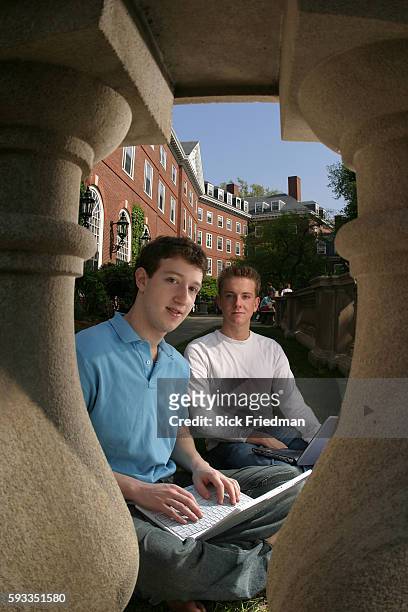 Facebook founders Mark Zuckerberg and Chris Hughes on the Harvard University campus, three months after launching Facebook from their Harvard dorm...