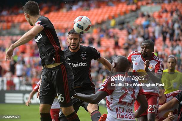 United defender Steve Birnbaum and D.C. United forward Patrick Mullins attempt to head in the ball during a corner kick in the first half of the...