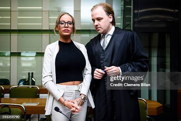 Gina-Lisa Lohfink and lawyer Burkhard Benecken talk at the biginning of a court trial on August 22, 2016 in Berlin, Germany. The 29-year-old model...