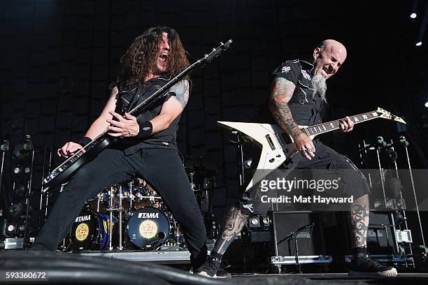 Frank Bello and Scott Ian of Anthrax performs on stage during the 99.9 KISW Pain In The Grass music festival at White River Amphitheatre on August...