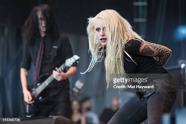 Alecia 'Mixi' Demner of Stitched Up Heart performs on stage during the Pain In The Grass music festival hosted by 99.8 KISW at White River...
