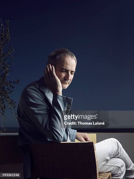 Director Olivier Assayas is photographed for Self Assignment on May 17, 2014 in Cannes, France.