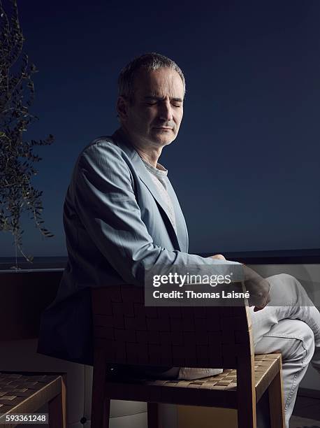 Director Olivier Assayas is photographed for Self Assignment on May 17, 2014 in Cannes, France.