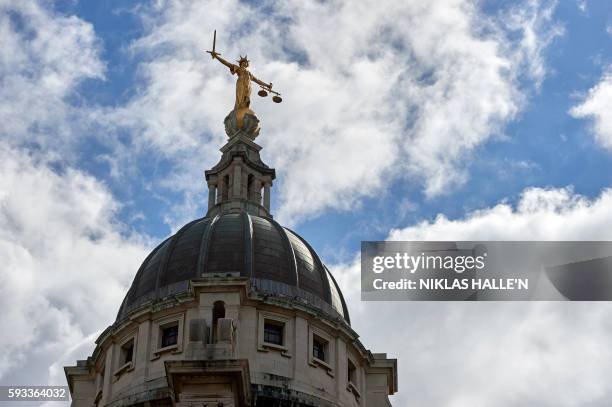 The "Lady of Justice", a 12 foot high, gold leaf statue is pictured on top of the dome of the Central Criminal Court, commonly referred to as The Old...