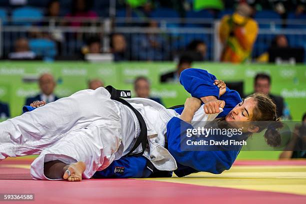 Nora Gjakova of Kosovo arm-locks Yadinys Amaris Colombia into submission for an ippon to move to the next u57kg round during day 3 of the 2016 Rio...