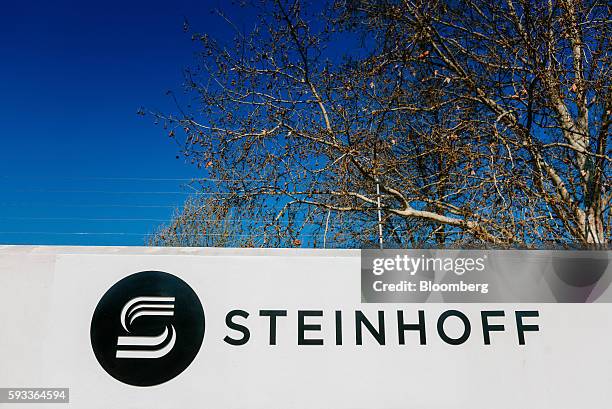 Steinhoff International Holdings NV logo sits on display outside the company's offices in Stellenbosch, South Africa, on Wednesday, Aug. 17, 2016....