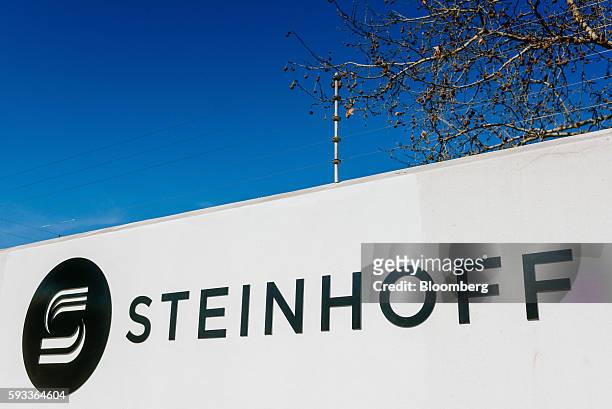 Steinhoff International Holdings NV logo sits on display outside the company's offices in Stellenbosch, South Africa, on Wednesday, Aug. 17, 2016....