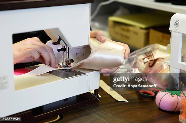 Kellie Amend sews in ribbons to a new pair of pointe shoes at Assemble Dancewear on August 11 in Castle Rock, Colorado. Noel Amend has been fitting...