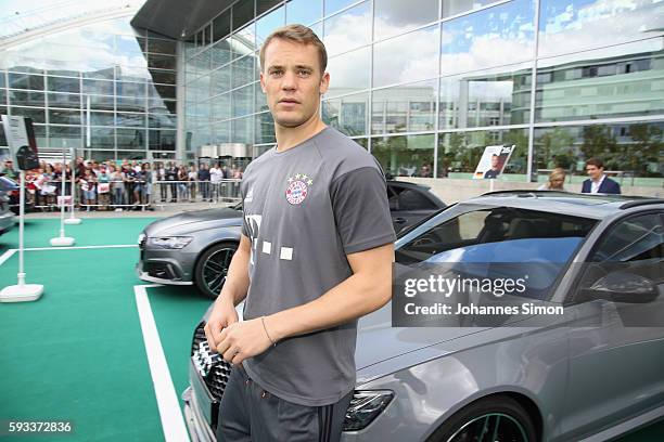 Manuel Neuer of FC Bayern looks on in front of his new Audi car during the official car handover at Audi Forum on August 22, 2016 in Ingolstadt,...