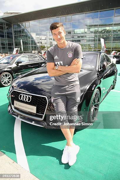 Robert Lewandowski of FC Bayern poses with his new Audi car during the official car handover at Audi Forum on August 22, 2016 in Ingolstadt, Germany.