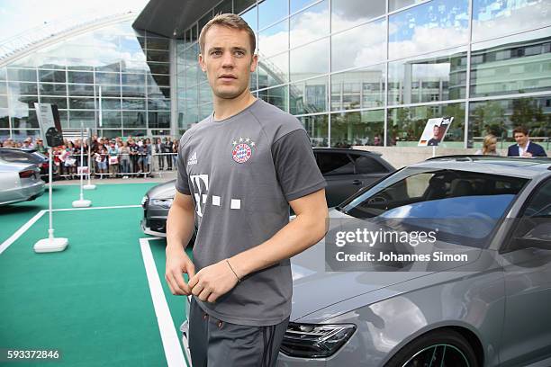 Manuel Neuer of FC Bayern looks on in front of his new Audi car during the official car handover at Audi Forum on August 22, 2016 in Ingolstadt,...