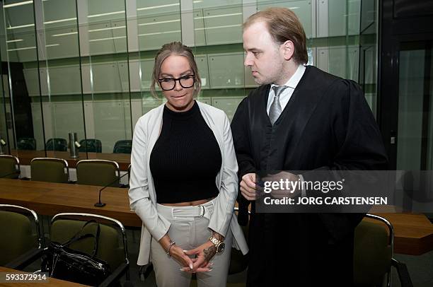 German model Gina-Lisa Lohfink and her lawyer Burkhard Benecken arrive to the the District Court of Tiergarten in Berlin, on August 22, 2016. Lohfink...