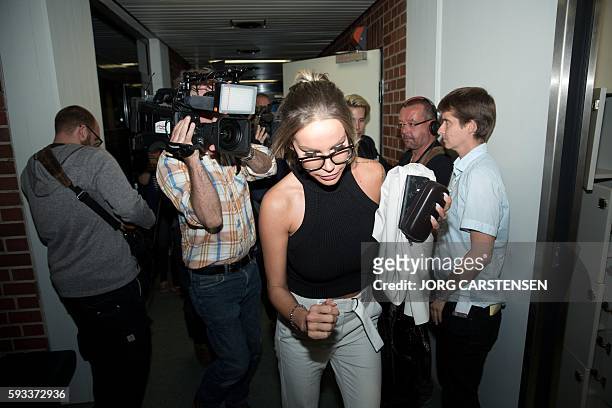 German model Gina-Lisa Lohfink leaves the the District Court of Tiergarten in Berlin, on August 22, 2016. Lohfink falsely accused two men of raping...