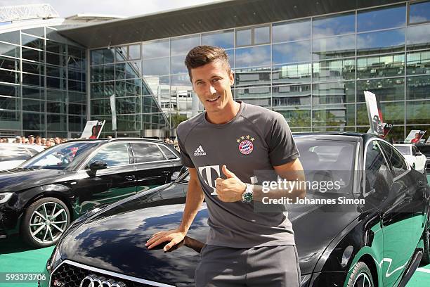 Robert Lewandowski of FC Bayern poses with his new Audi car during the official car handover at Audi Forum on August 22, 2016 in Ingolstadt, Germany.