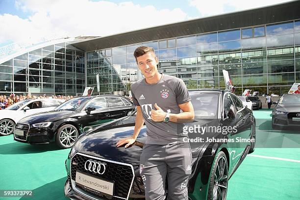 Robert Lewandowski of FC Bayern poses with his new Audi car during the official car handover at Audi Forum on August 22, 2016 in Ingolstadt, Germany.