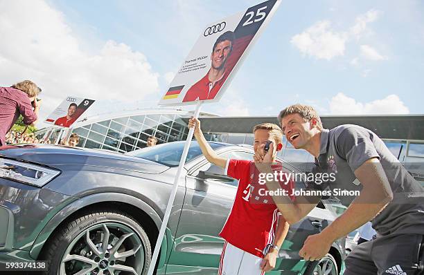 Thomas Mueller of FC Bayern poses with his new Audi car during the official car handover at Audi Forum on August 22, 2016 in Ingolstadt, Germany.