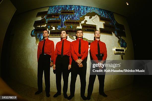 Kraftwerk in front of world time clock in Keio Plaza Hotel, Tokyo, September 1981.