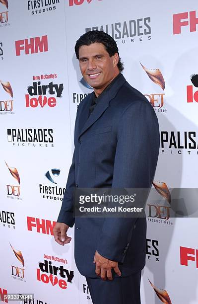 Former baseball player Jose Conseco arrives at the premiere for the movie "Dirty Love" at the ArcLight Cinema in Hollywood.