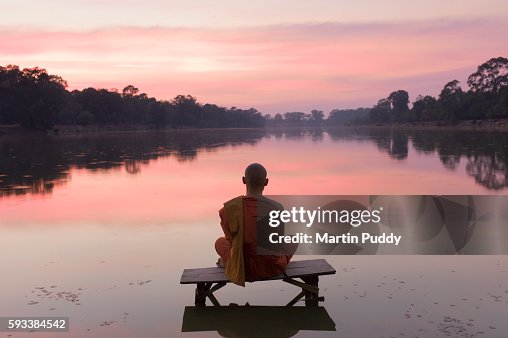 Cambodia, Angkor Wat, Buddhist Monk at sunset