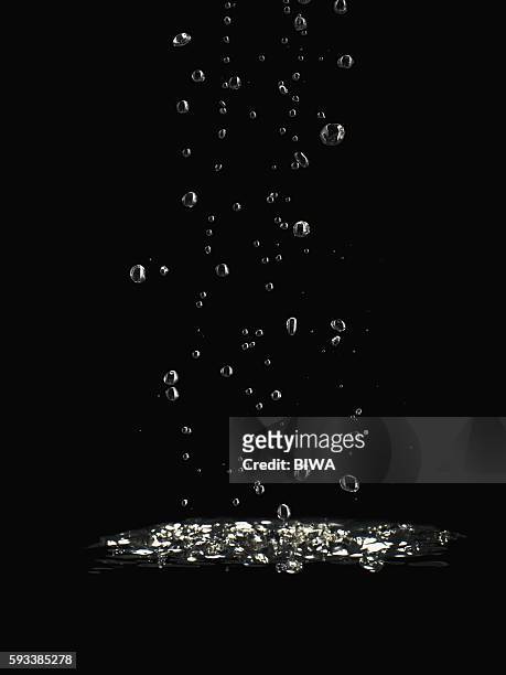 bubbles in water - water drop stock pictures, royalty-free photos & images