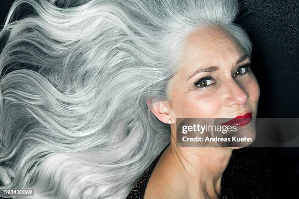 portrait of a woman in a 3/4 profile position. - white hair stock-fotos und bilder