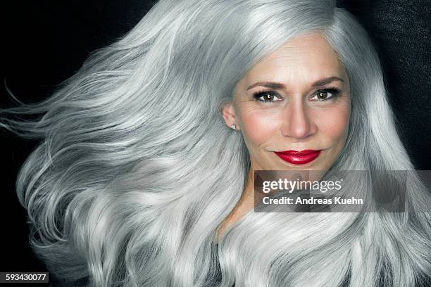 woman with big, wavy, silver gray hair, portrait. - woman with red lipstick stock pictures, royalty-free photos & images