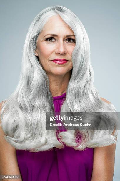 woman with long, shiny, gray hair, portrait. - portrait white hair studio stock pictures, royalty-free photos & images