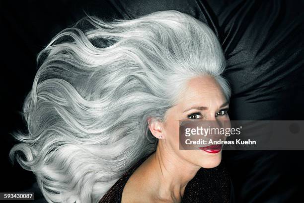 glamorous portrait of a woman with long gray hair. - capelli grigi foto e immagini stock