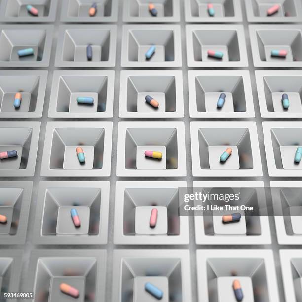 pill / medication capsules in steel cups - pills colorful stock pictures, royalty-free photos & images