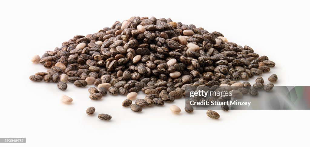 Large pile of chia seed on white background