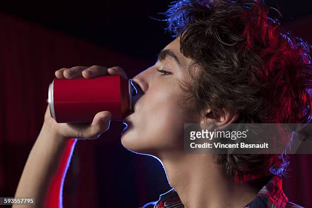 teen drinking from a can - vincent young stock pictures, royalty-free photos & images