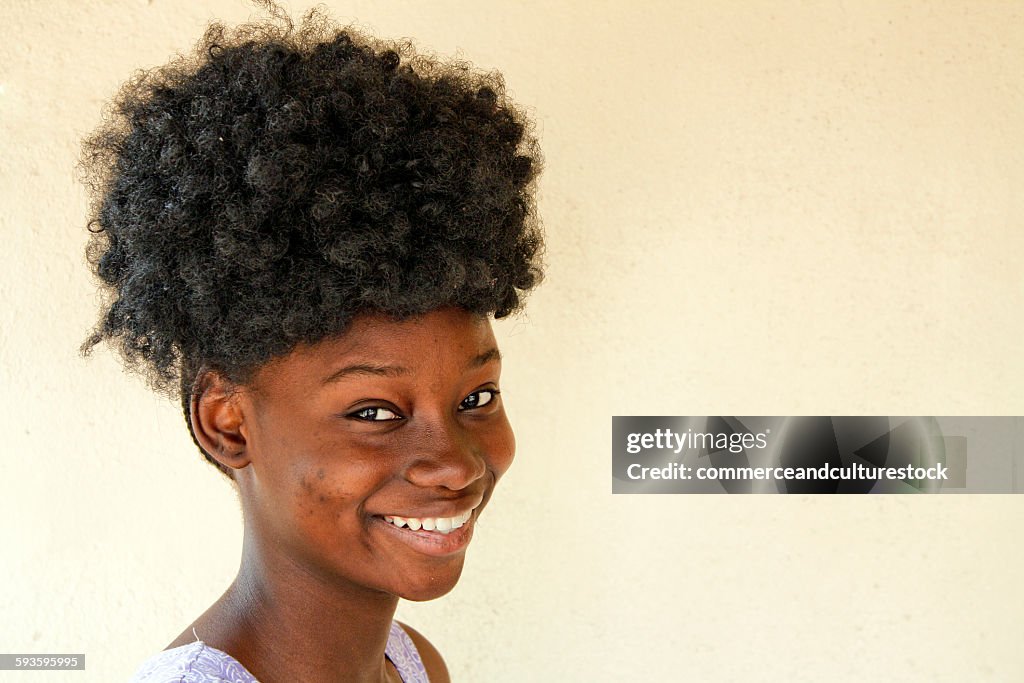 A smiling with a funny hairstyle