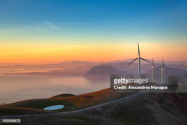 wind farm sunset - greece landscape stock pictures, royalty-free photos & images