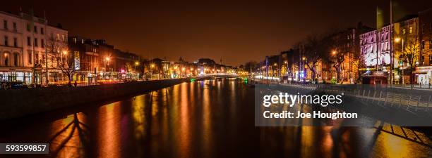 liffey panorama from o'connell street bridge - dublin city skyline stock-fotos und bilder