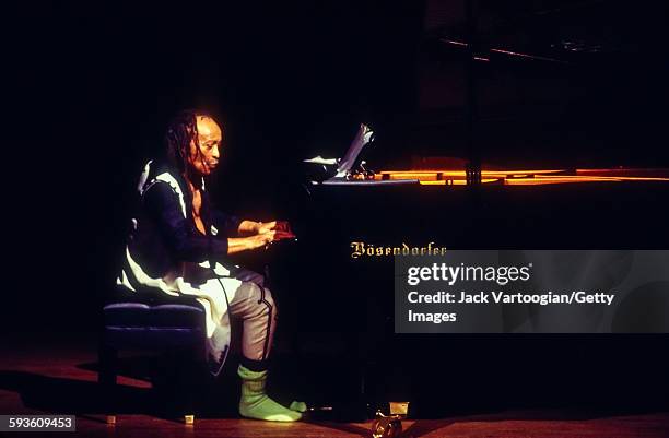 American Free Jazz musician, poet, and composer Cecil Taylor plays piano as he performs at a solo concert celebrating his 65th birthday presented by...