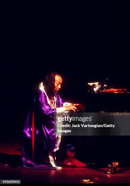 American Free Jazz musician, poet, and composer Cecil Taylor plays piano as he performs at a solo concert celebrating his 65th birthday presented by...