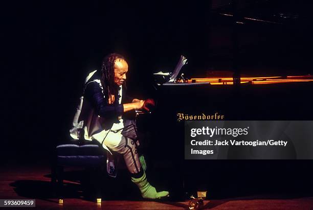 American Free Jazz musician, poet, and composer Cecil Taylor plays piano as he performs at a solo concert celebrating his 65th birthday presented by...