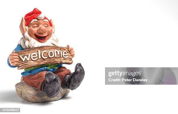 welcome garden gnome with copy space - gnomo da giardino foto e immagini stock