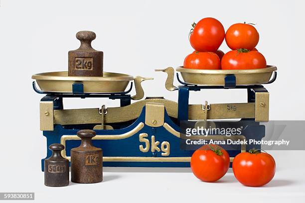 tomatos on a vintage scale - mass unit of measurement stock pictures, royalty-free photos & images