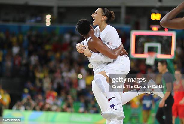 Basketball - Olympics: Day 15 Diana Taurasi of United States celebrates with Angel Mccoughtry of United States after the USA gold medal win during...