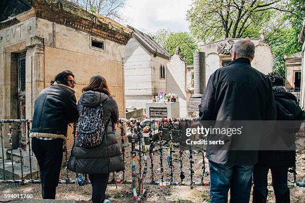 people visiting jim morrison's grave in paris, france - door name plate stock pictures, royalty-free photos & images